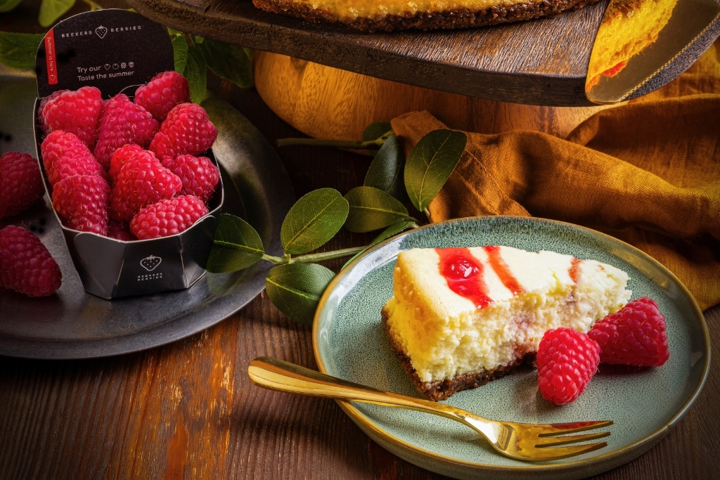 Homemade white chocolate cheesecake with raspberries